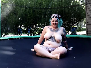 Fat Tattooed Milf Jumping and Stripping on a Trampoline